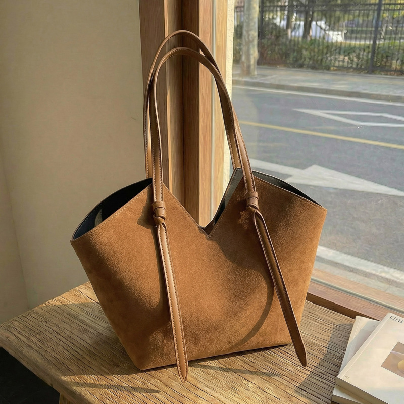 trysho-suede-tote-featured Women’s faux suede tote bag set with tassel detail
